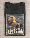 Black Washed Otter Urgently Relaxing Graphic Tee